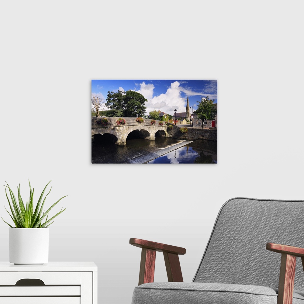 A modern room featuring Ireland, Mayo, Westport, View along The Mall with River Carrowbeg
