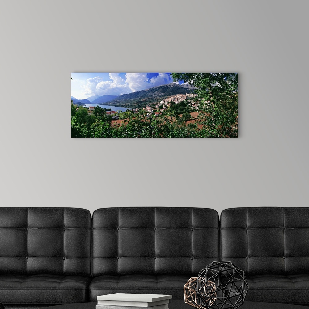 A modern room featuring Italy, Abruzzo, Abruzzi, Abruzzo National Park, Barrea, View of town and lake