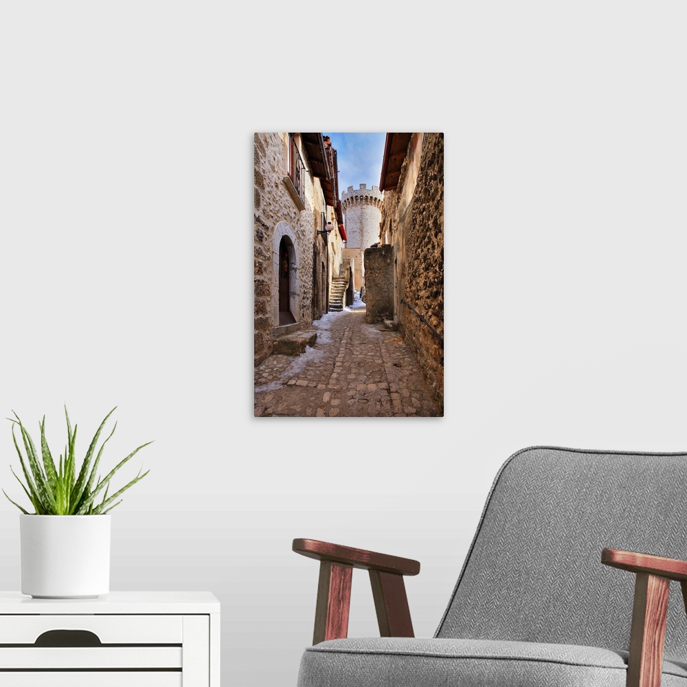 A modern room featuring Italy, Abruzzo, L'Aquila district, View of the medieval tower in the village center