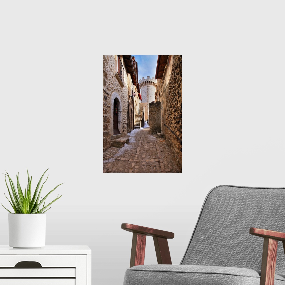 A modern room featuring Italy, Abruzzo, L'Aquila district, View of the medieval tower in the village center