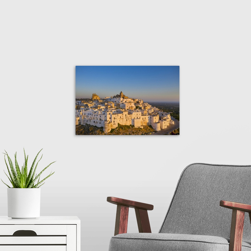 A modern room featuring Italy, Apulia, Brindisi district, Itria Valley, Ostuni, View of Ostuni village
