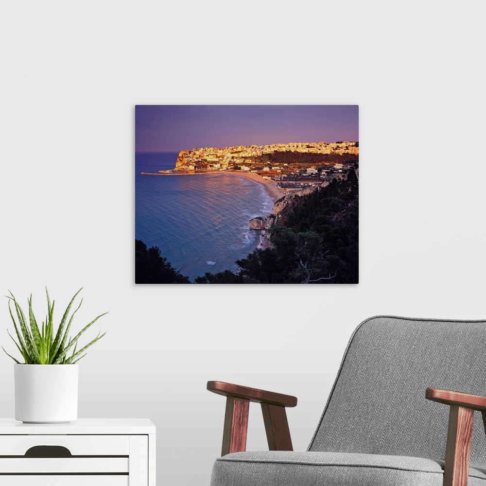 A modern room featuring A view of the seaside village of Peschici, the most picturesque of the Gargano area.