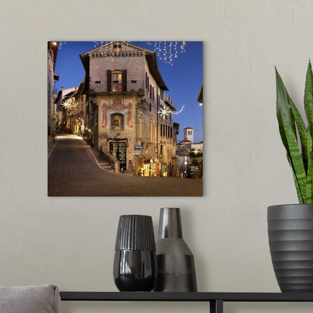 A modern room featuring Italy, Umbria, Perugia district, Assisi, Town decorated for Christmas.