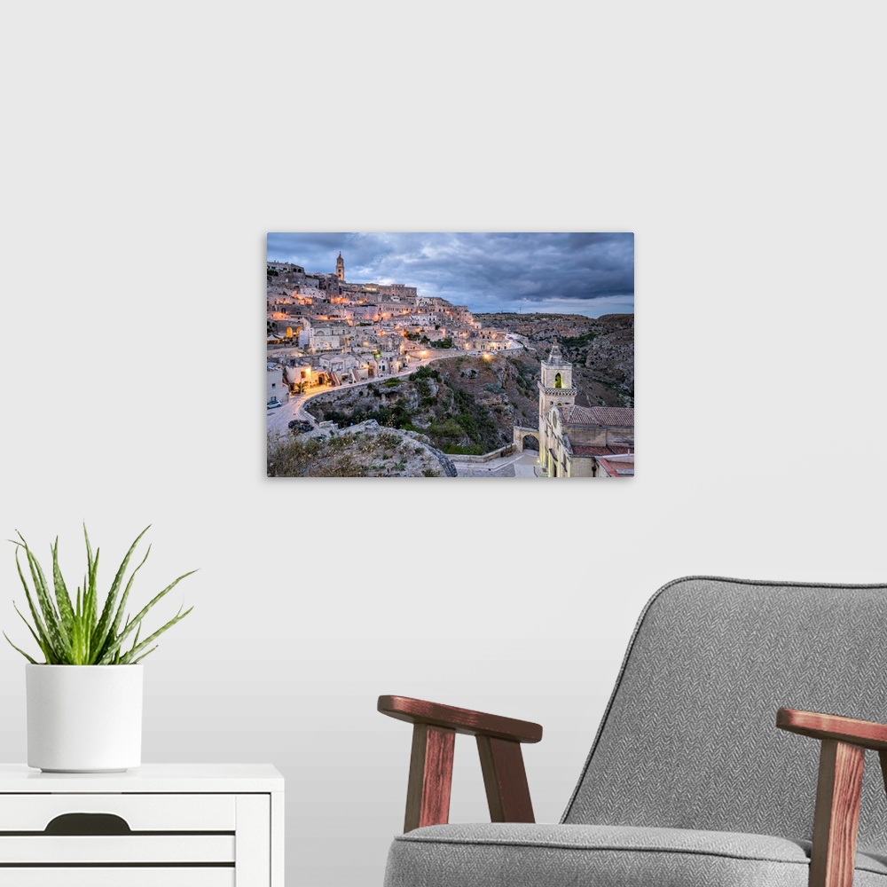 A modern room featuring Italy, Basilicata, Matera, Sasso Barisano view from Sasso Caveoso and, in the foreground, the pop...