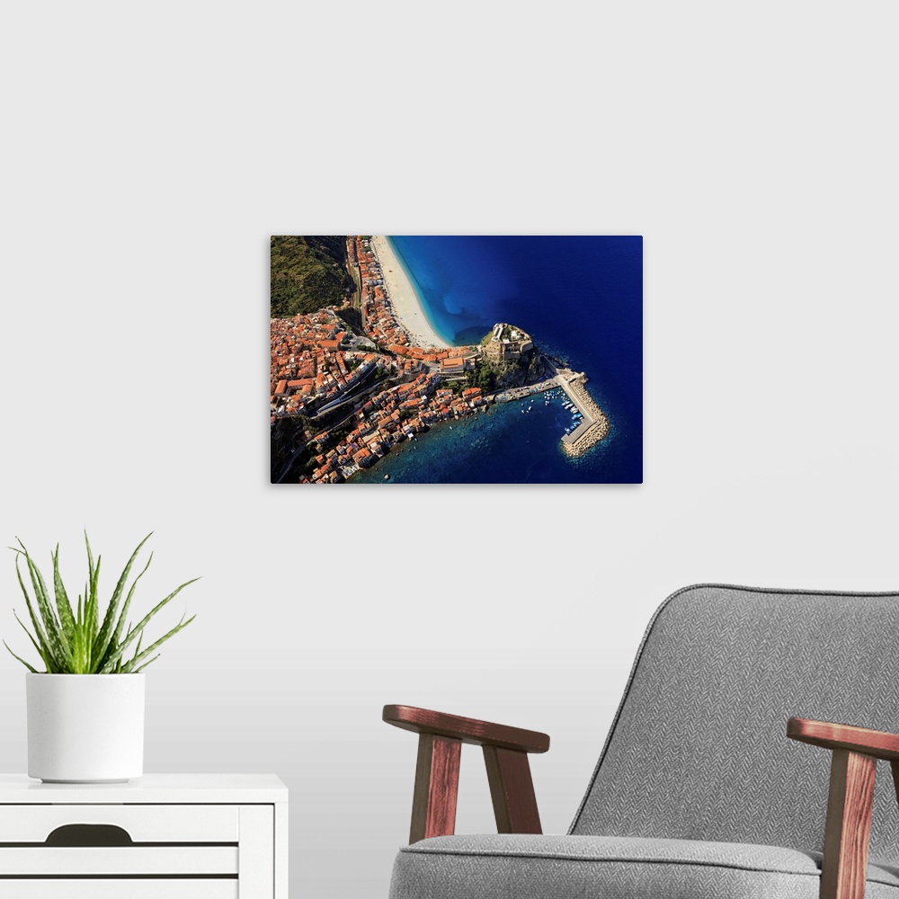 A modern room featuring Italy, Calabria, Costa Viola, Scilla, Aerial view of the town, beach and Castle
