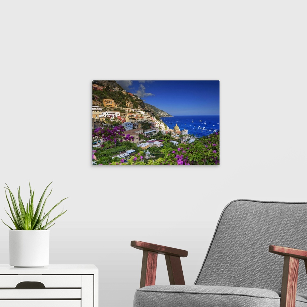 A modern room featuring Italy, Campania, Amalfi Coast, Positano, Positano village at sunset