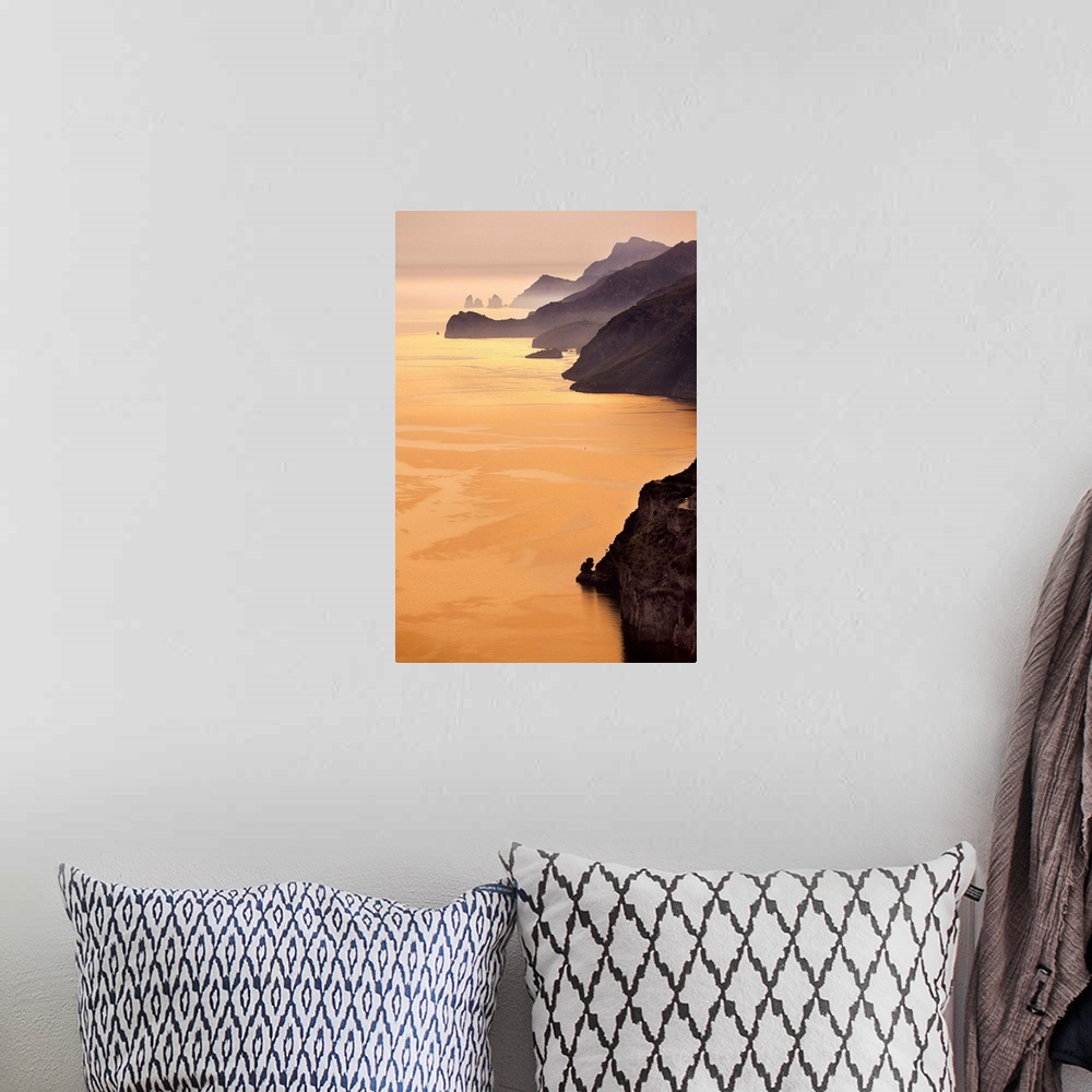 A bohemian room featuring Italy, Campania, Amalfi Coast, Tyrrhenian coast, Positano, Rugged coastline at sunset