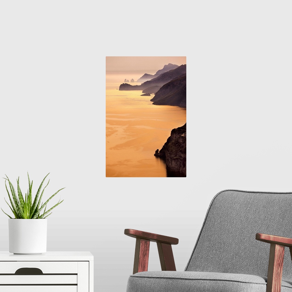 A modern room featuring Italy, Campania, Amalfi Coast, Tyrrhenian coast, Positano, Rugged coastline at sunset