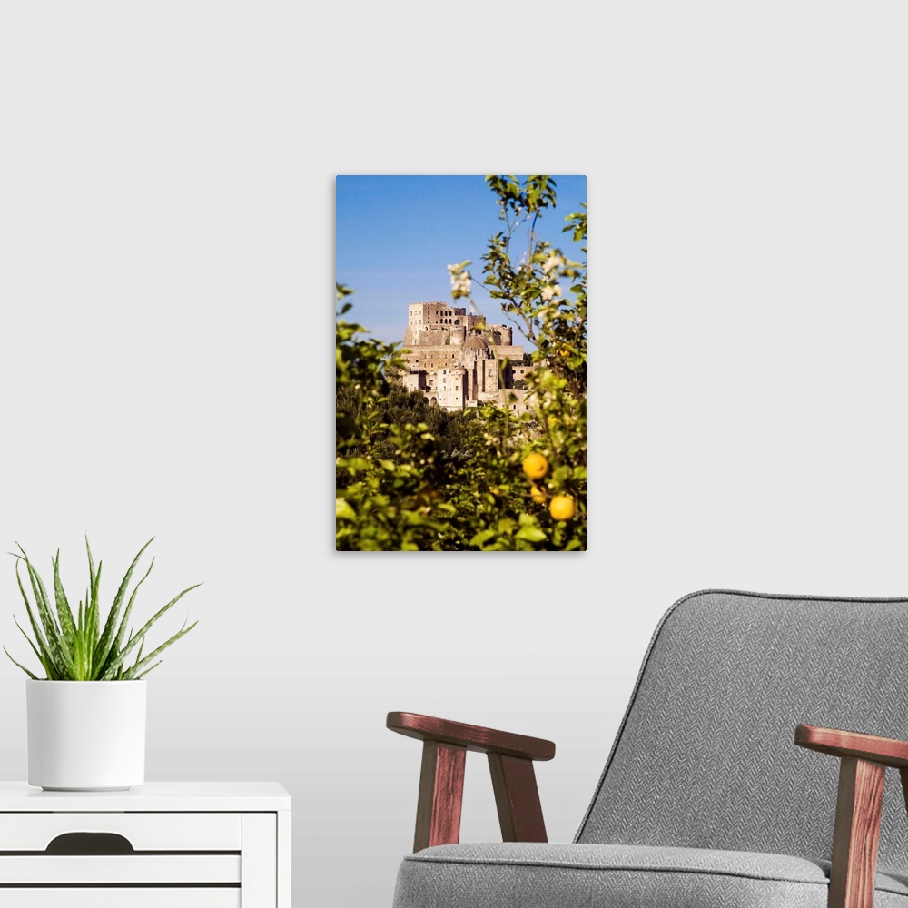 A modern room featuring Italy, Campania, Ischia Island, Ischia Ponte, Aragonese Castle with lemon tree