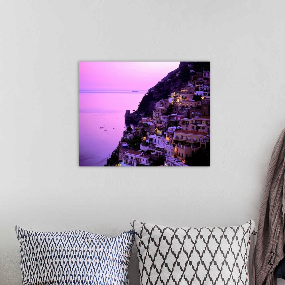 A bohemian room featuring Italy, Campania, Positano, Amalfi coast, view over town at dusk