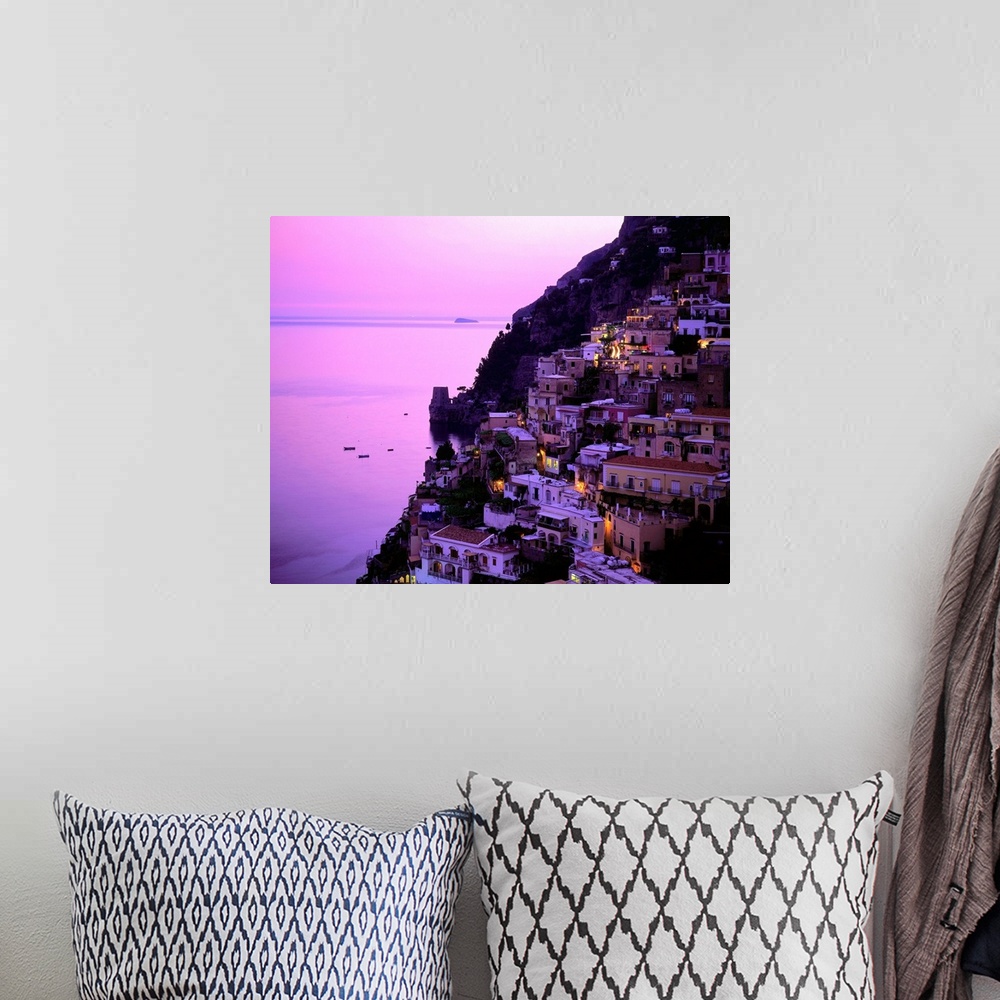 A bohemian room featuring Italy, Campania, Positano, Amalfi coast, view over town at dusk