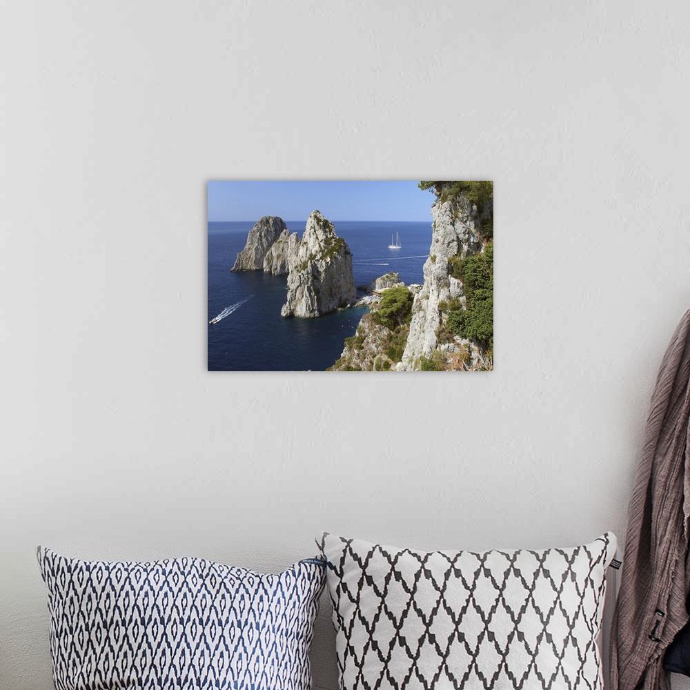 A bohemian room featuring Italy, Campania, Tyrrhenian coast, Napoli district, Capri, The Faraglioni (stack rocks)