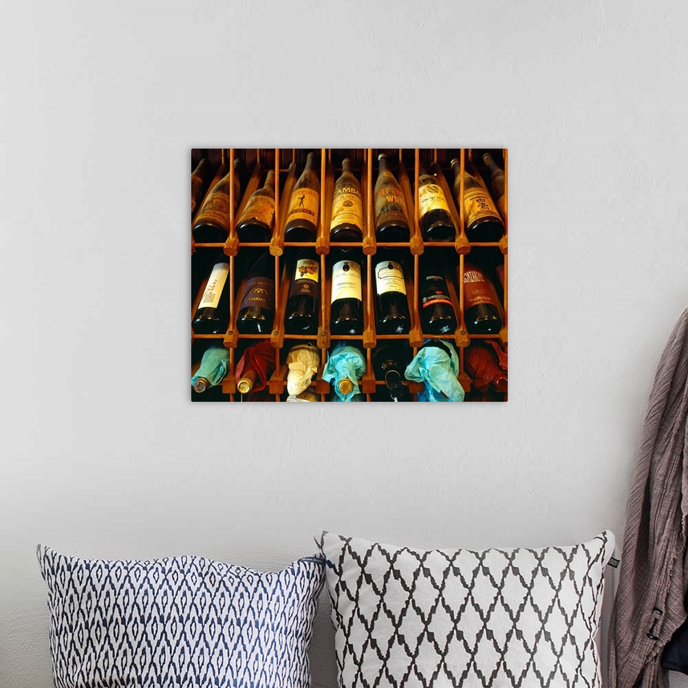 A bohemian room featuring Italy, Emilia Romagna, Ferrara, Enoteca 'Al Brindisi' wine bottles