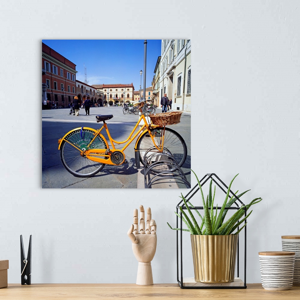 A bohemian room featuring Italy, Emilia Romagna, Ravenna, Piazza del Popolo, bicycle locked to rack