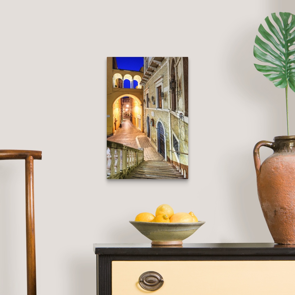 A traditional room featuring Italy, Marches, Fermo district, Fermo, Piazza del Popolo (People's Square) at night.