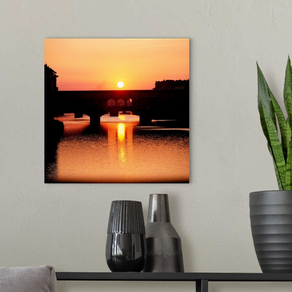 A modern room featuring Italy, Florence, Ponte Vecchio at sunset