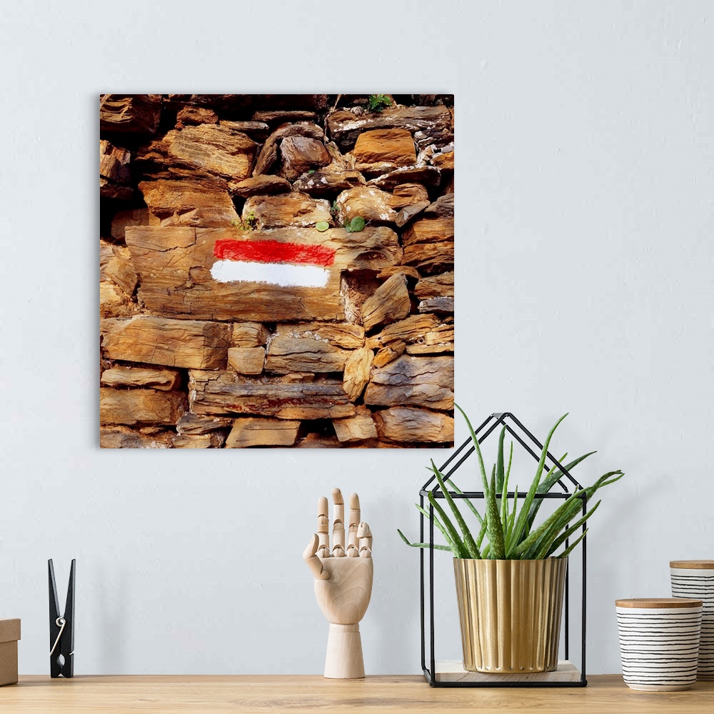 A bohemian room featuring Italy, Liguria, Cinque Terre, Footpath marker on dry-stone wall