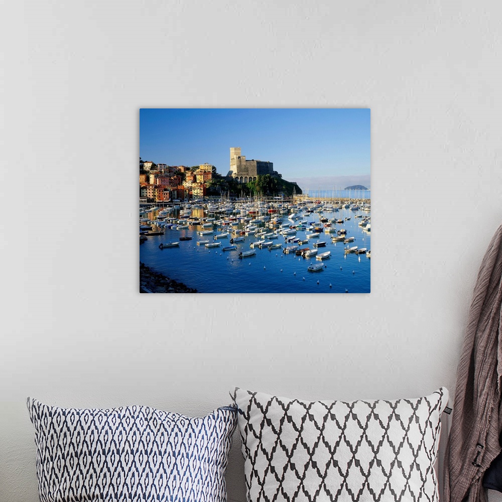 A bohemian room featuring Italy, Liguria, Lerici town, view towards the harbor and the castle