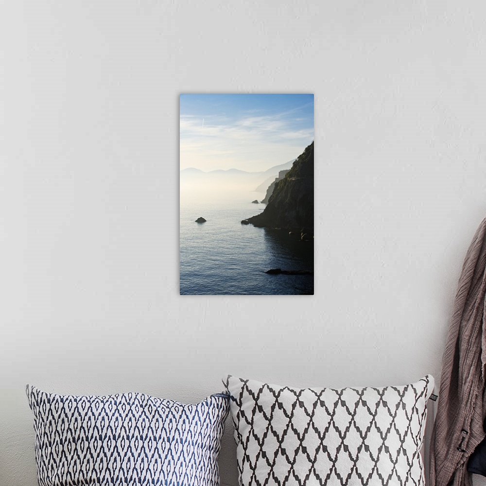 A bohemian room featuring Italy, Liguria, Vernazza and Monterosso as seen from Corniglia at sunset