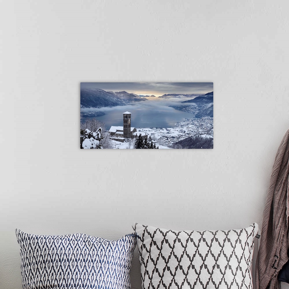 A bohemian room featuring Italy, Lombardy, Como Lake, Peglio, Sant'Eusebio church and the lake with snow