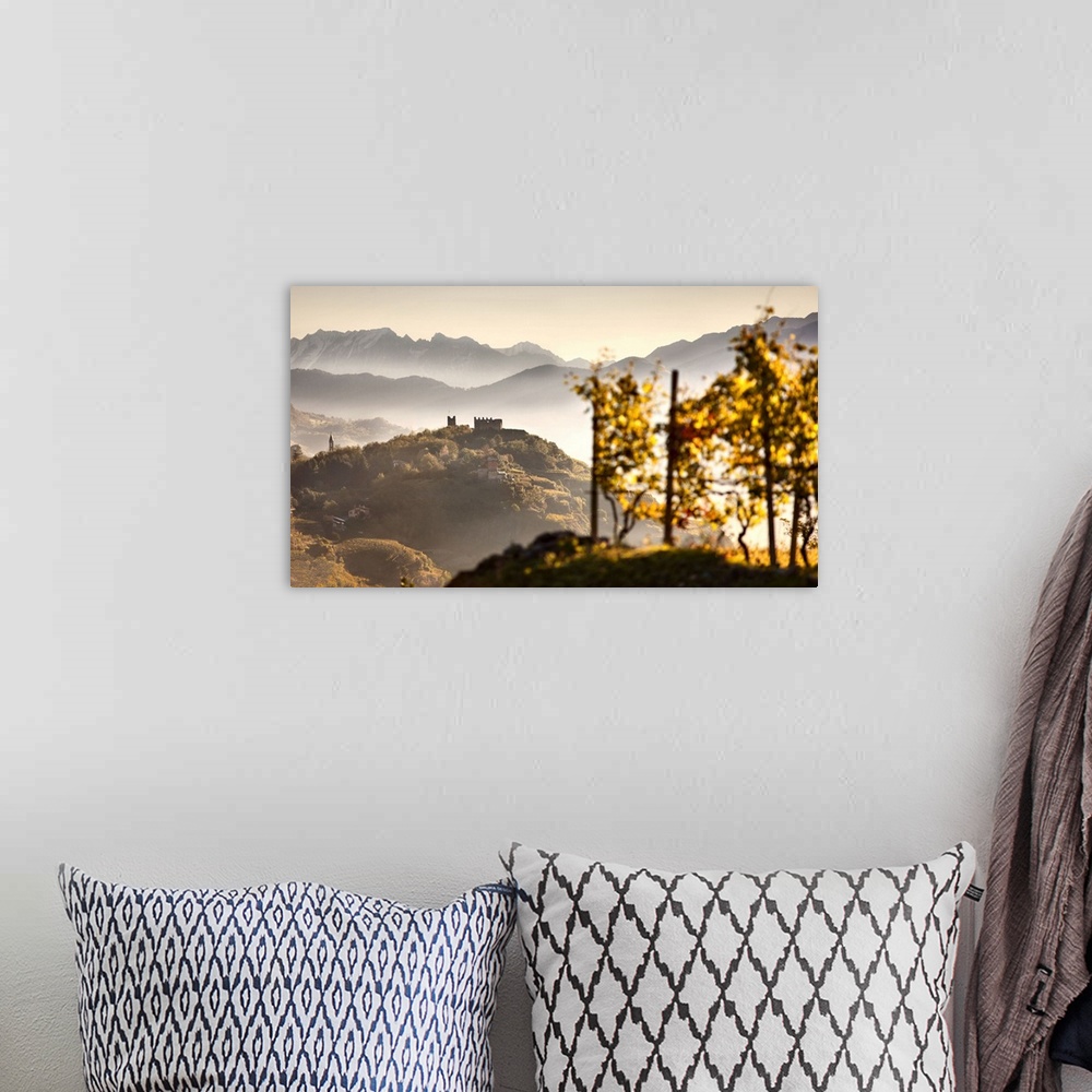 A bohemian room featuring Italy, Lombardy, Sondrio district, Valtellina, Landscape with Grumello castle on top of the hill ...