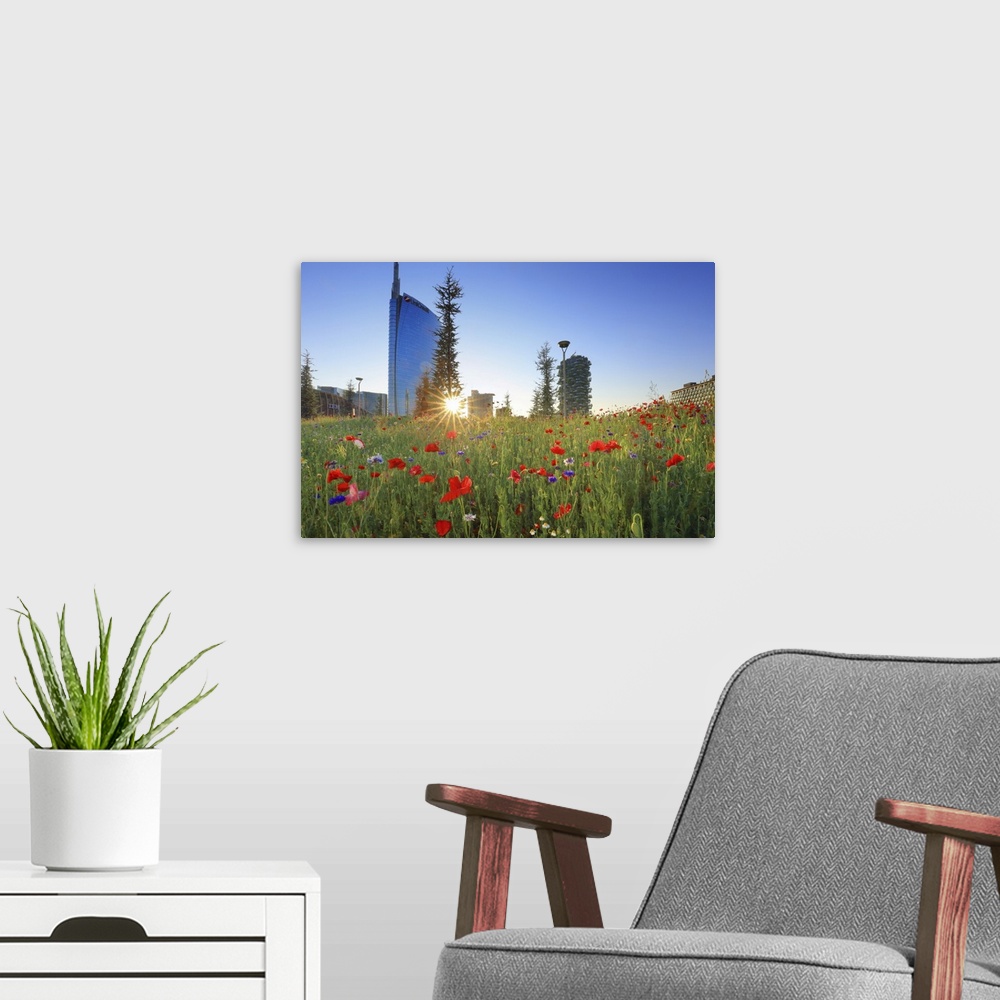 A modern room featuring Italy, Lombardy, Milano district, Milan, Porta Nuova, Flowers with the Unicredit Tower and one of...