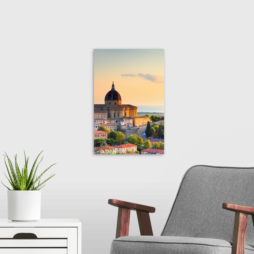 A modern room featuring Italy, Marches, Ancona district, Loreto, Loreto Cathedral at sunrise.