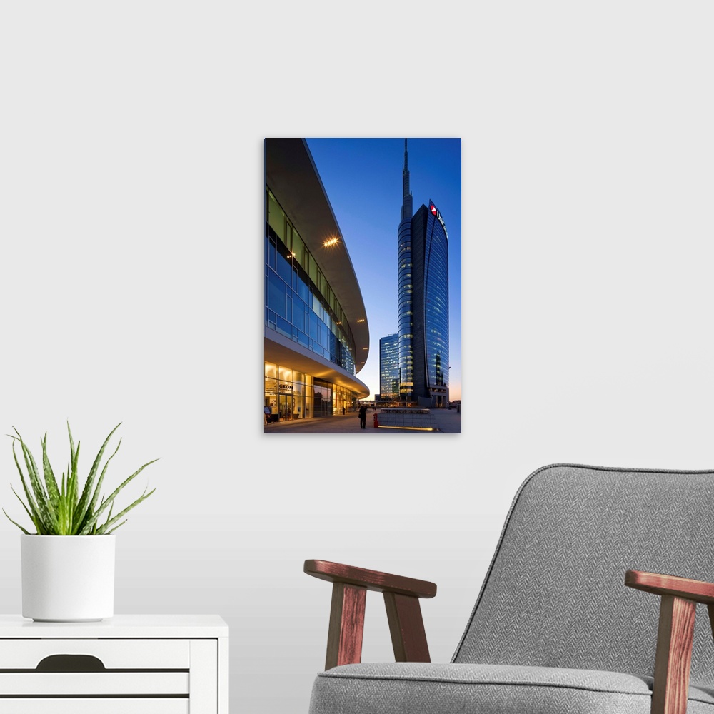 A modern room featuring Italy, Lombardy, Milano district, Milan, Cesar Pelli Tower in Gae Aulenti Square.