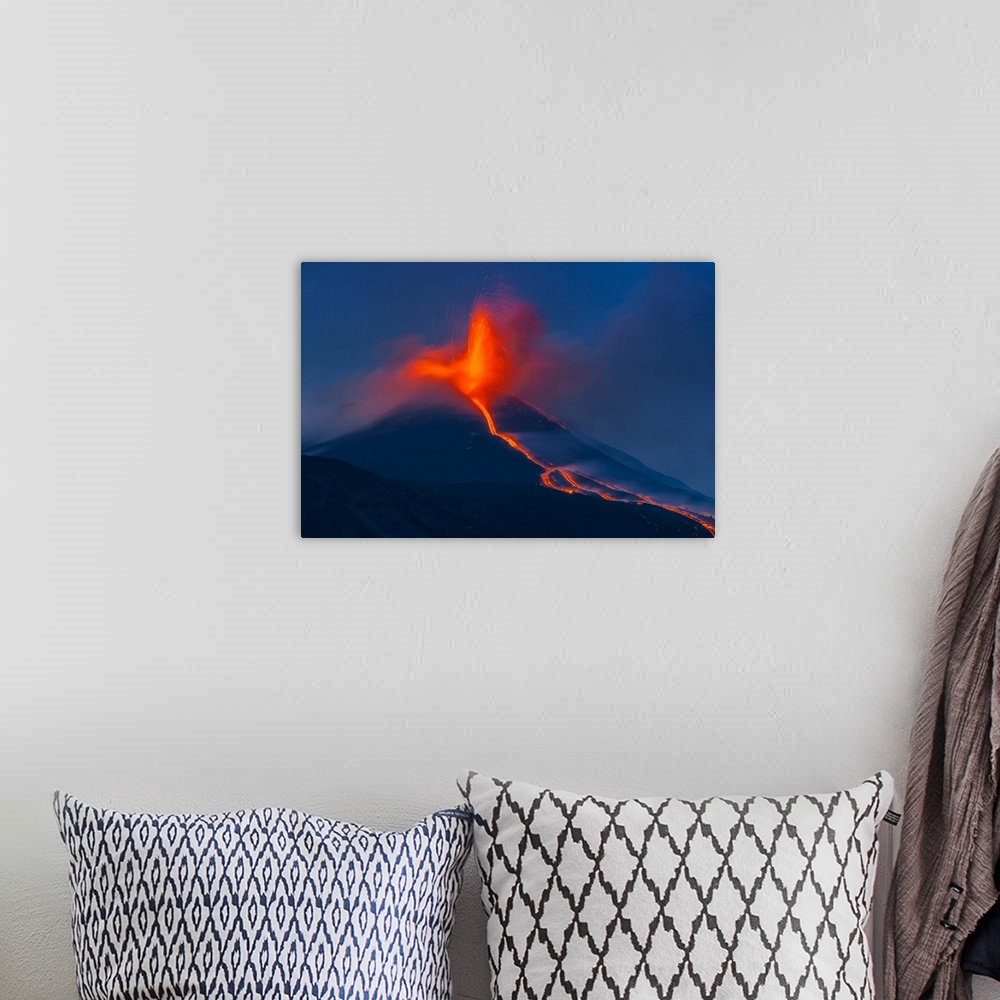 A bohemian room featuring Italy, Sicily, Catania district, Mount Etna, Strombolian eruption, lava flowing from the south-ea...