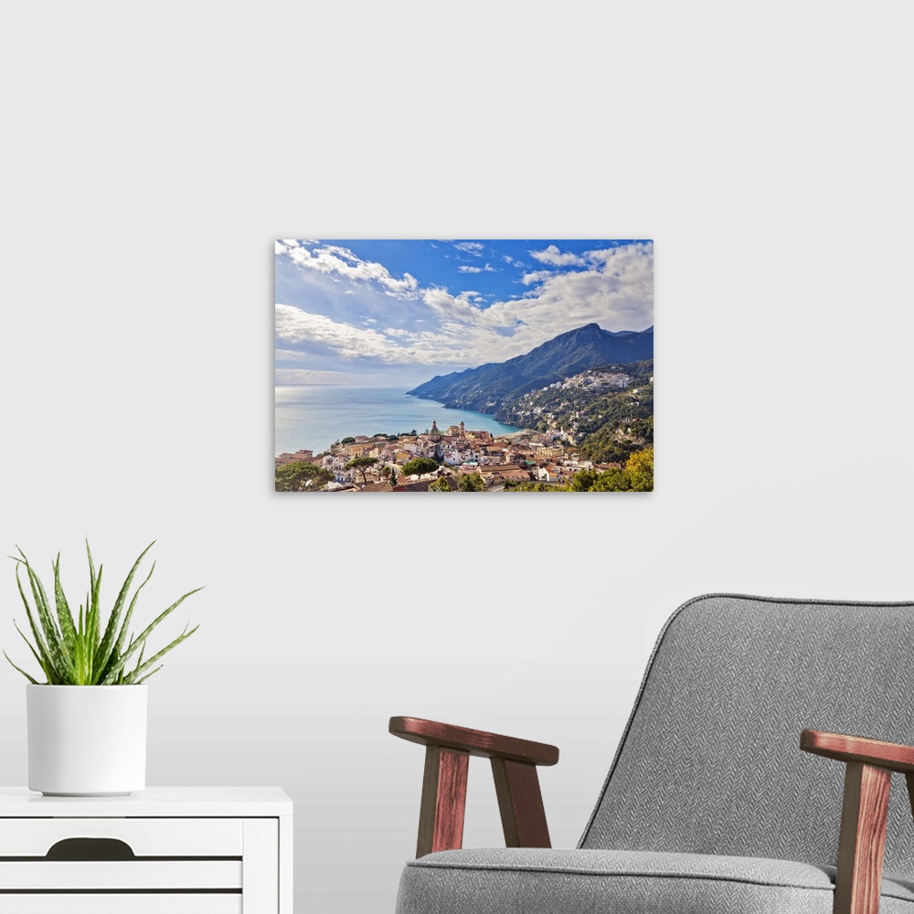 A modern room featuring Italy, Campania, Salerno district, Peninsula of Sorrento, Vietri sul Mare, Vietri sul Mare skyline.