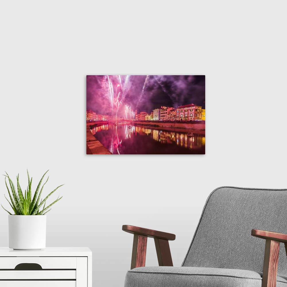 A modern room featuring Italy, Tuscany, Pisa district, Pisa, Fireworks at the Arno River waterfront during the Luminara d...