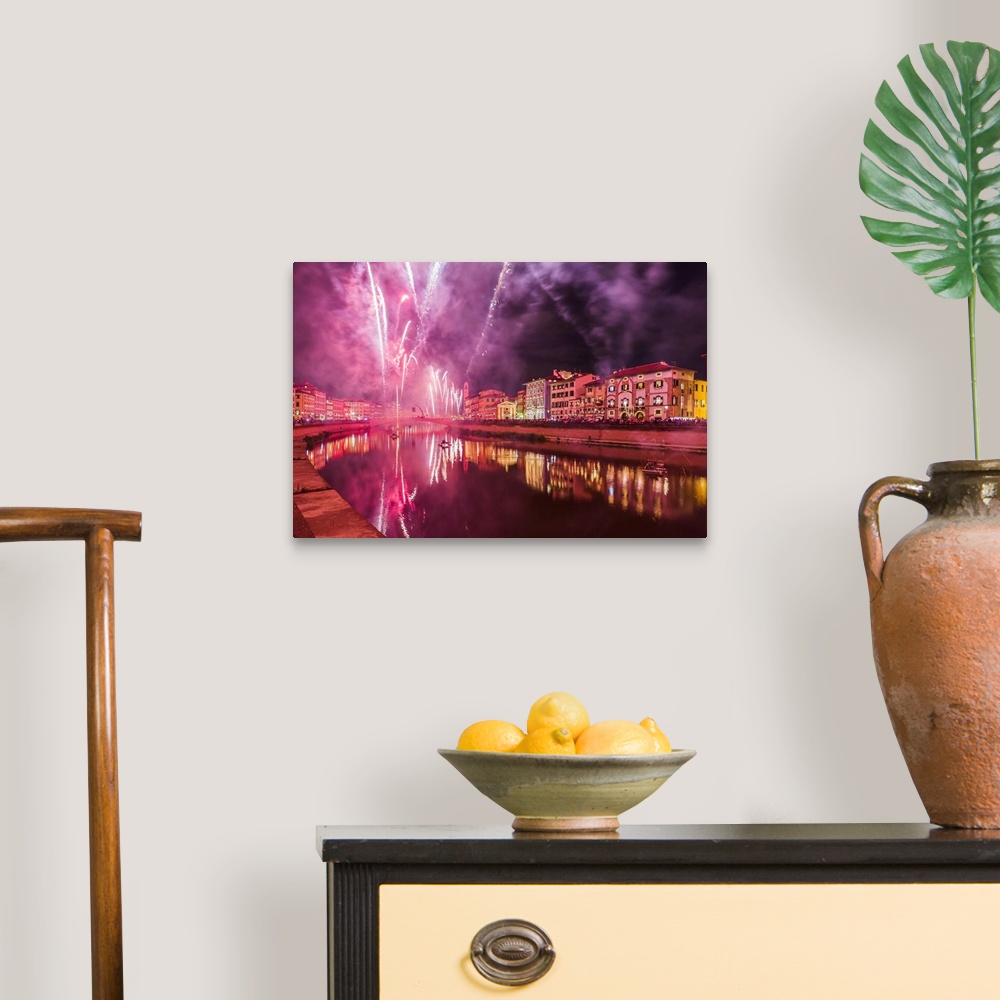 A traditional room featuring Italy, Tuscany, Pisa district, Pisa, Fireworks at the Arno River waterfront during the Luminara d...