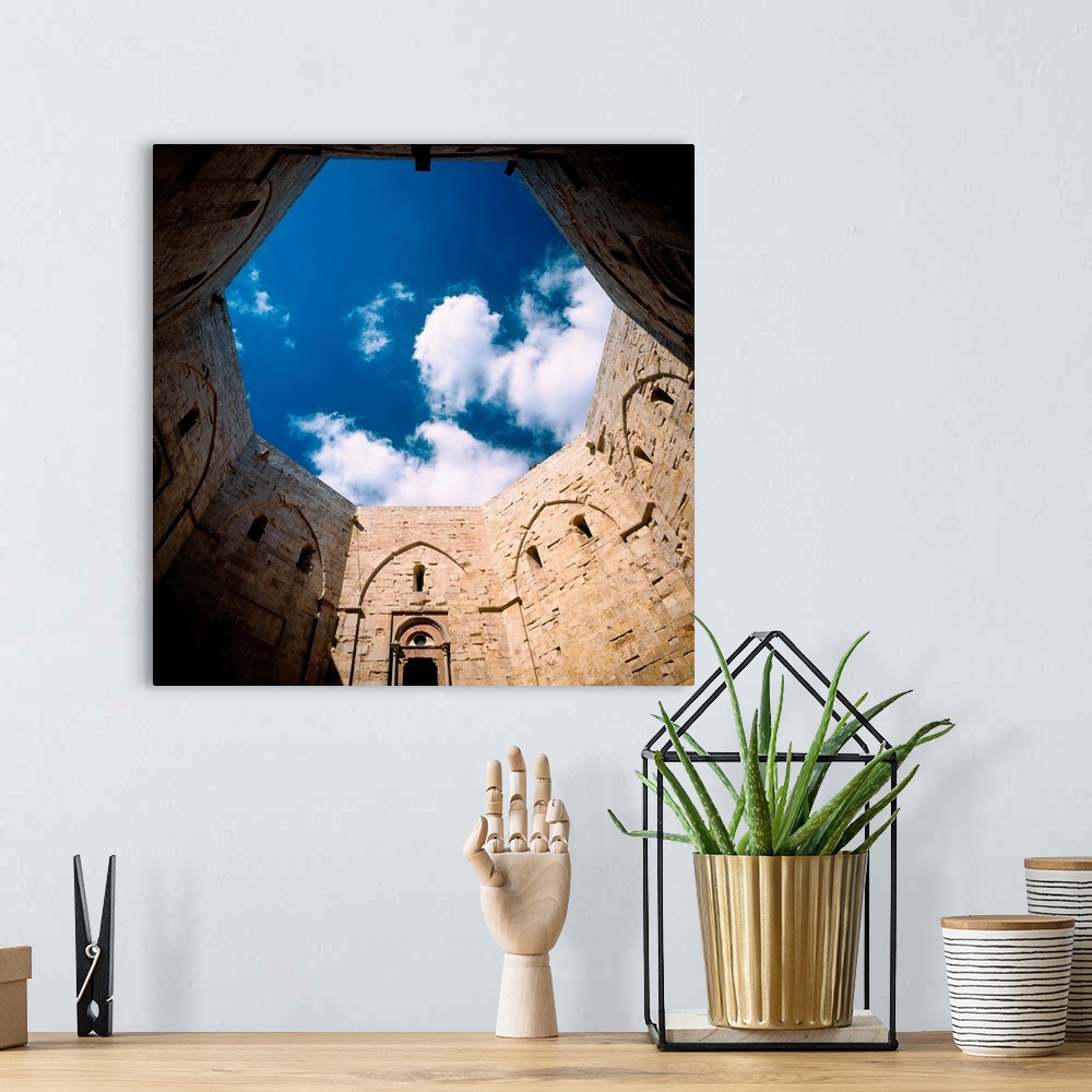 A bohemian room featuring Italy, Puglia, Castel del Monte, court of the fortress of Federico II