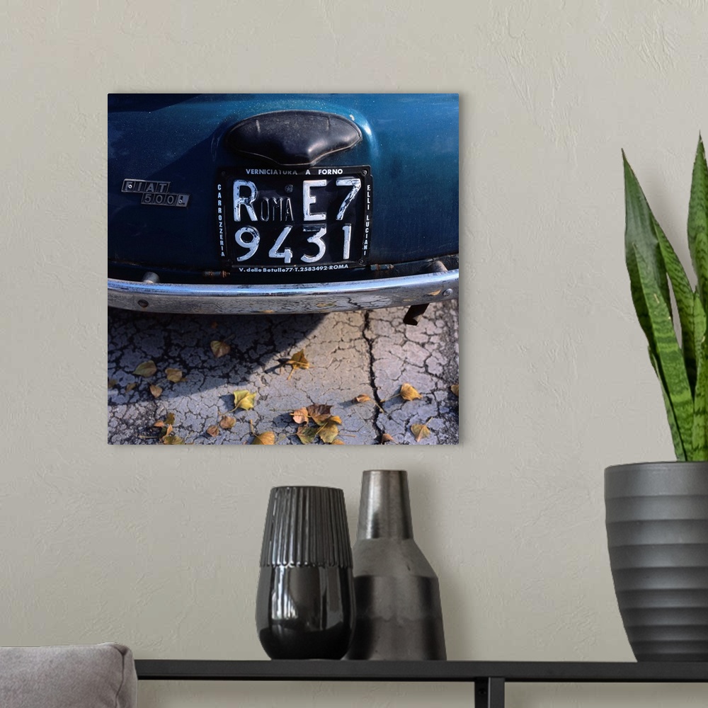 A modern room featuring Italy, Rome, Roma number plate on a Fiat 500