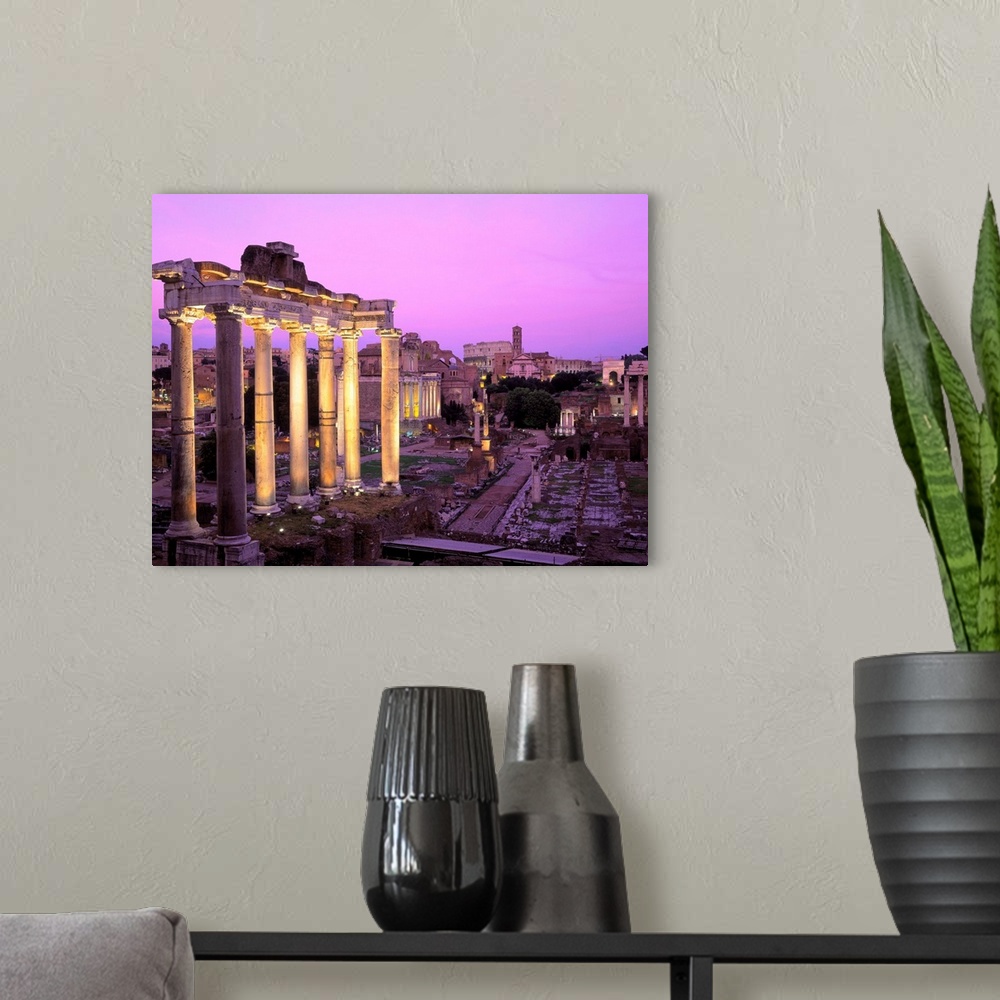 A modern room featuring Italy, Rome, Roman Forum, and Coliseum, night illuminated