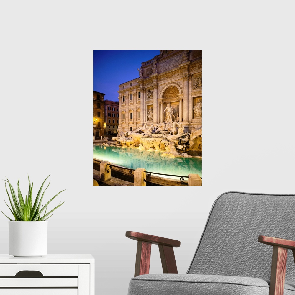 A modern room featuring Italy, Rome, Trevi Fountain, night