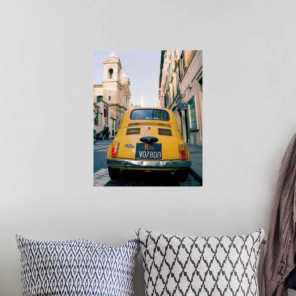 A bohemian room featuring Italy, Rome, yellow Fiat 500, via del Babuino, near Piazza Garibaldi