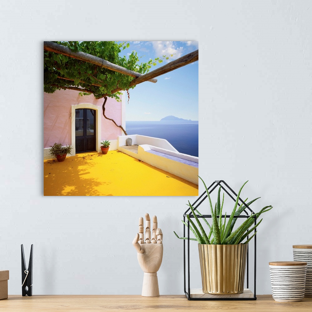 A bohemian room featuring Italy, Sicily, Alicudi island, typical architecture and Filicudi island in background