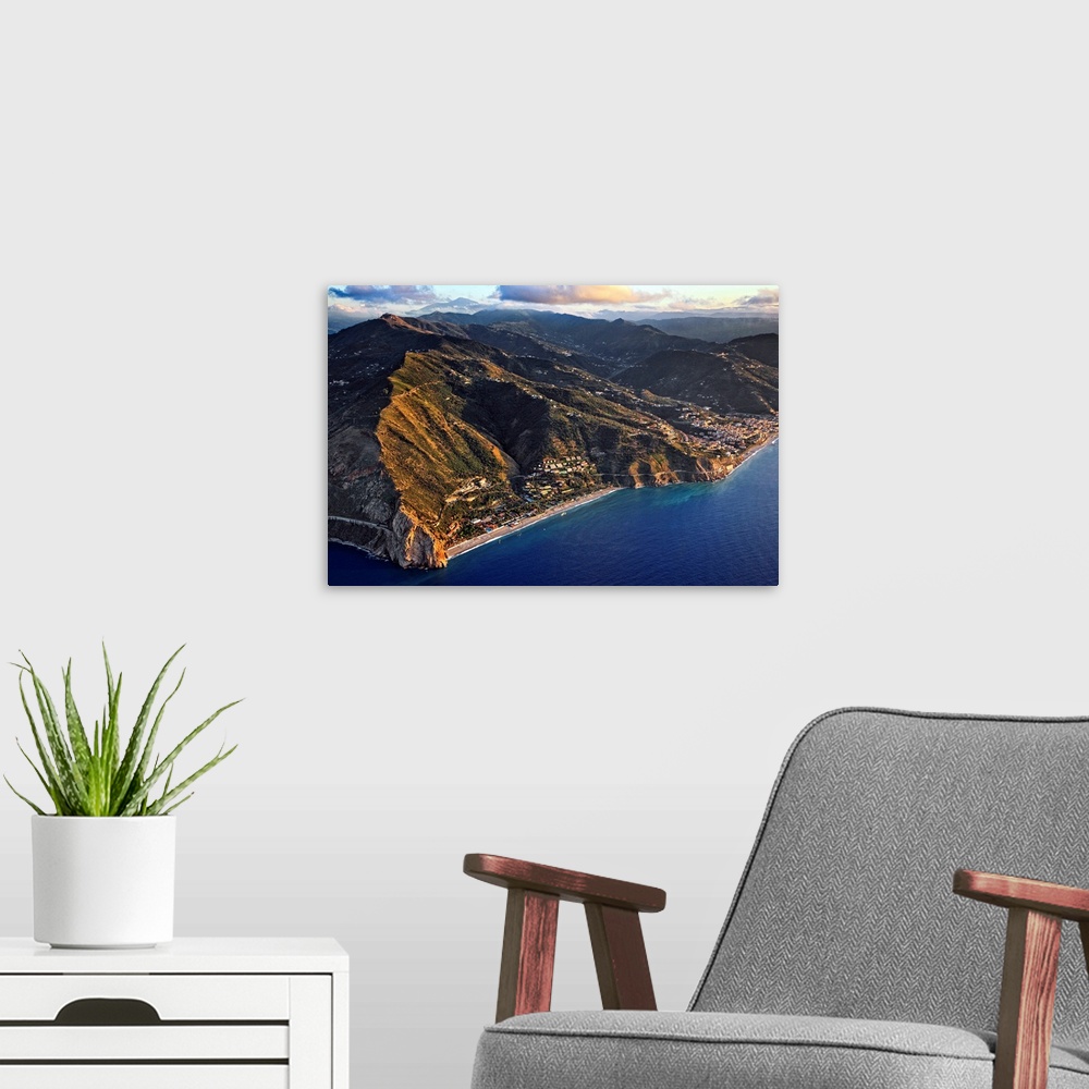 A modern room featuring Italy, Sicily, Costa Saracena, Messina district, Capo Calava and beach, aerial view