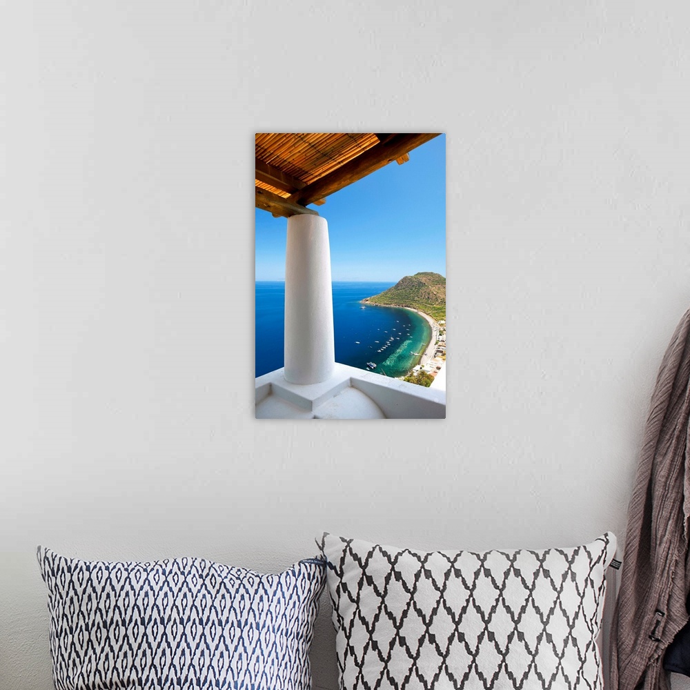 A bohemian room featuring Italy, Sicily, Lipari islands, Filicudi, Capo Graziano and the beach of the port