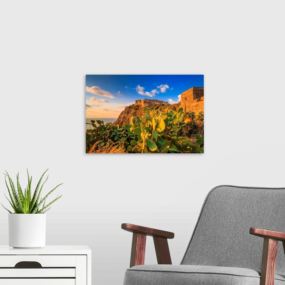 A modern room featuring Italy, Sicily, Messina district, Mediterranean sea, Milazzo, Castle at sunset.
