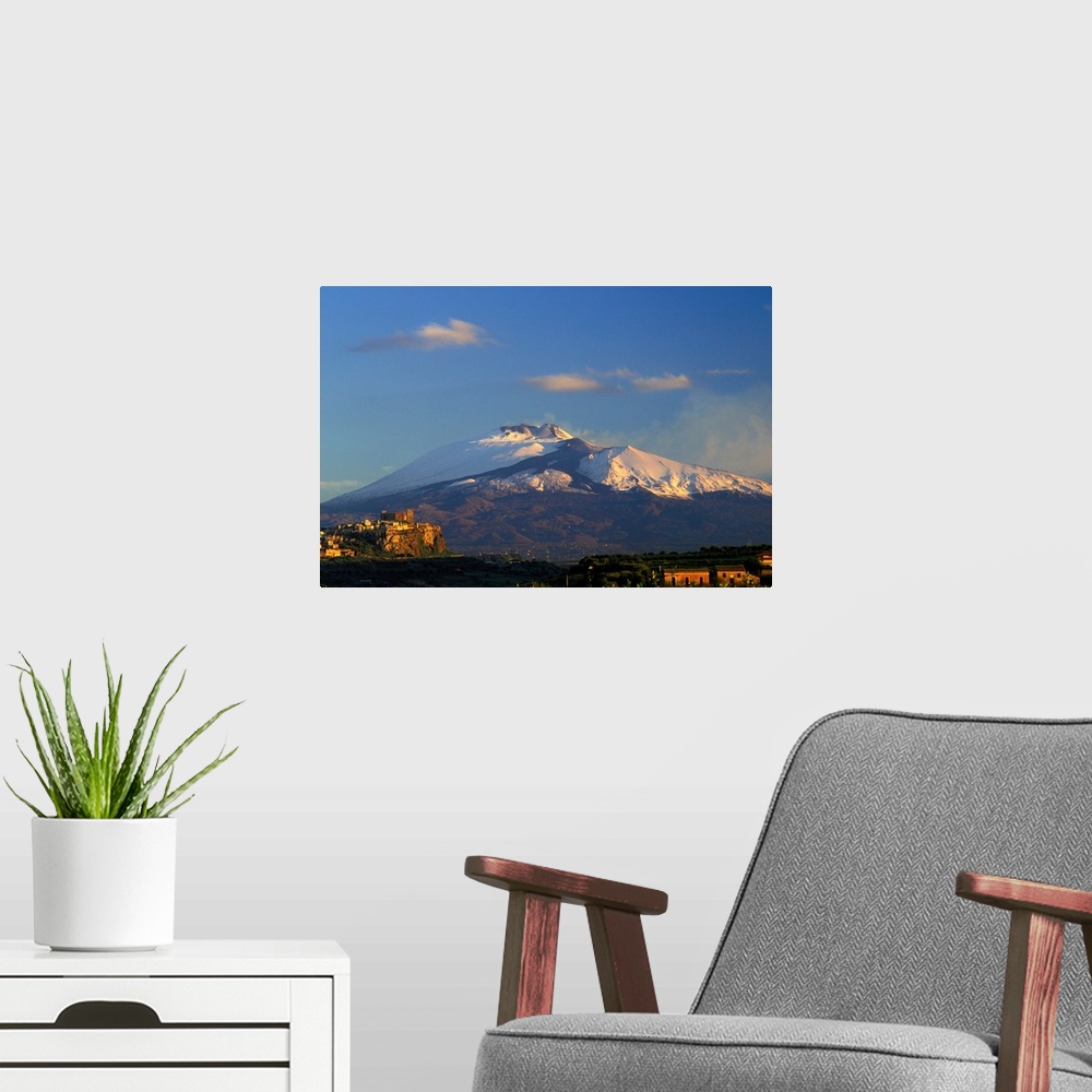 A modern room featuring Italy, Sicily, Motta Santa Anastasia, Mount Etna in background
