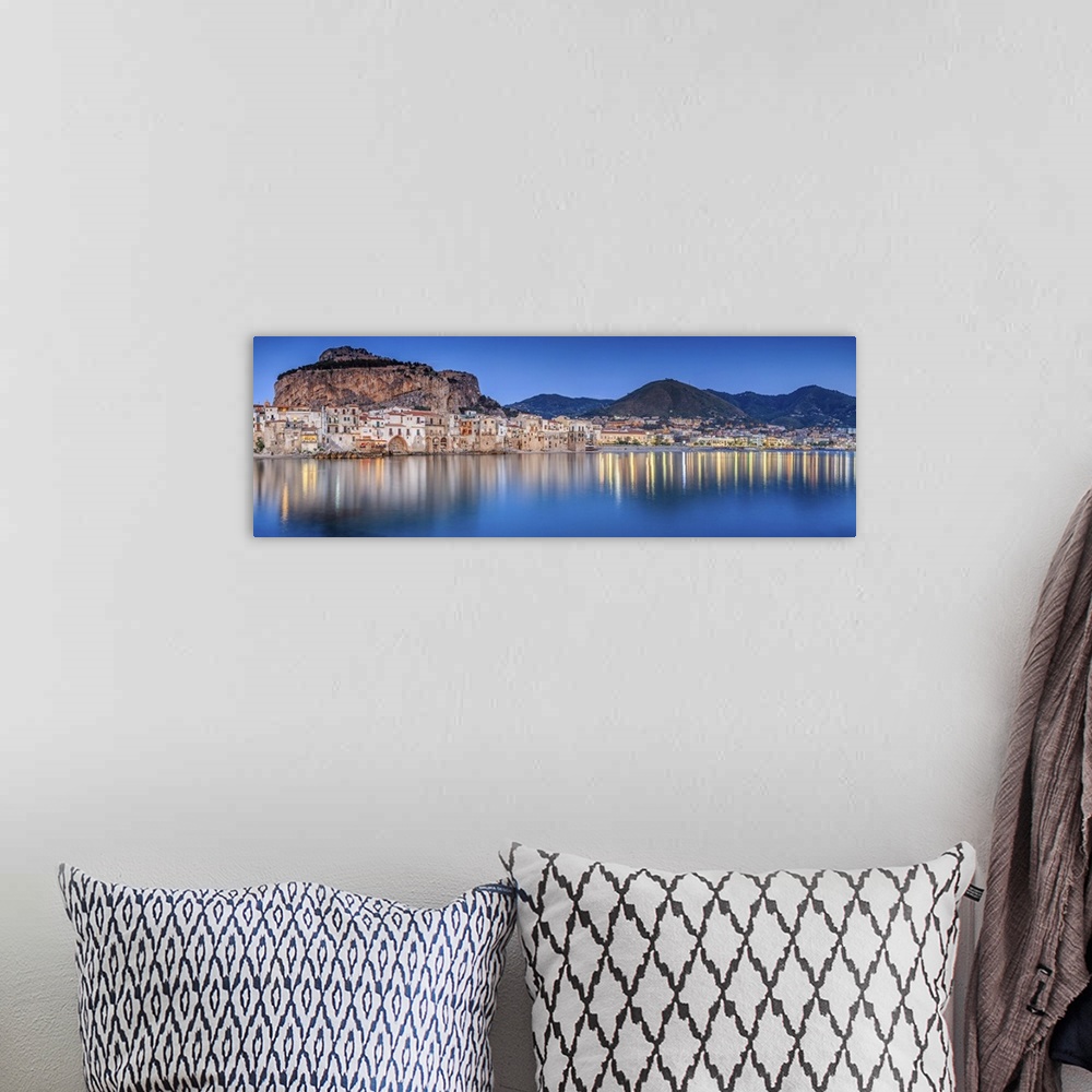 A bohemian room featuring Italy, Sicily, Palermo district, Cefalu, Harbor and old town at sunset