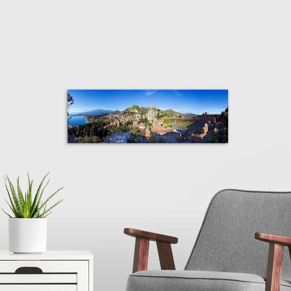 A modern room featuring Italy, Sicily, Taormina, Greek theatre and Mount Etna in background