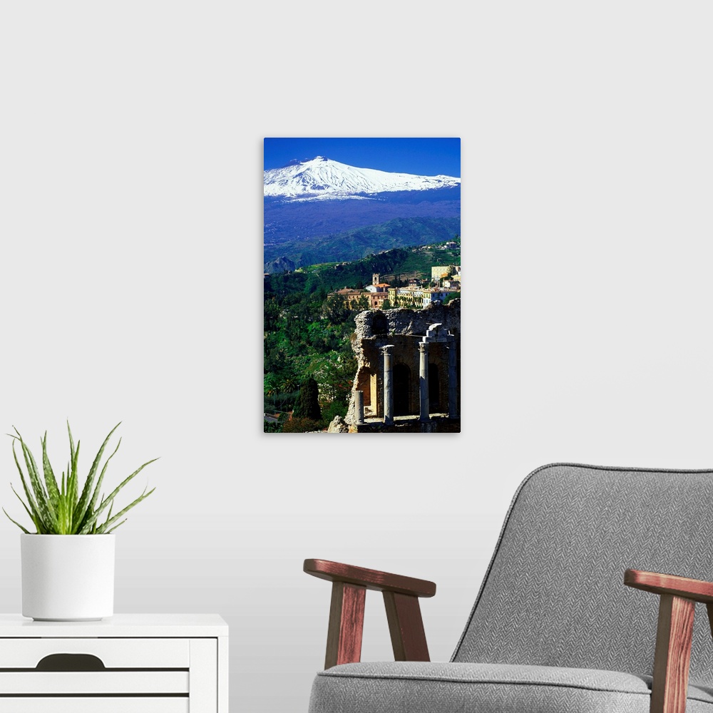 A modern room featuring Italy, Sicily, Taormina, Greek theatre, Mount Etna in background