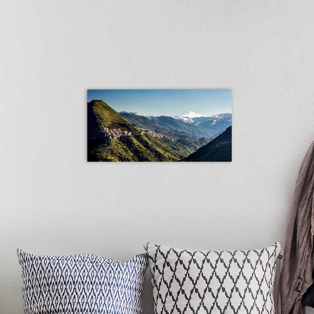 A bohemian room featuring Italy, Sicily, Tripi, Casale locality, the castle and Mount Etna in background.