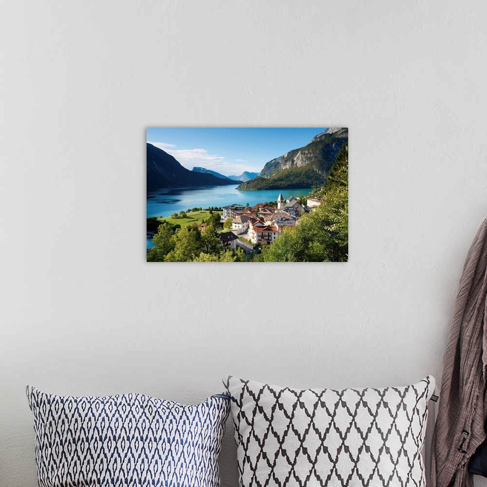 A bohemian room featuring Italy, Trentino, Alps, Val di Non, Molveno, View of Molveno lake and village