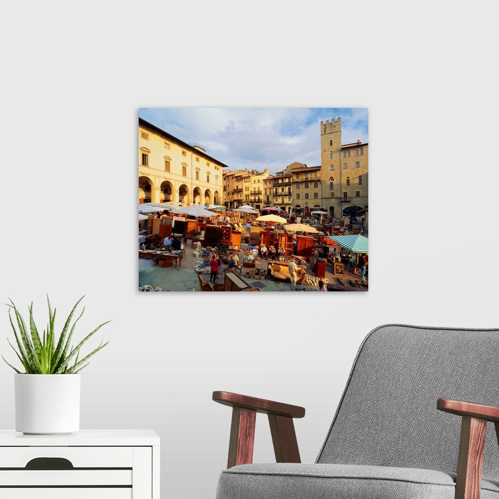 A modern room featuring Italy, Tuscany, Arezzo, Piazza Grande, antique trade market
