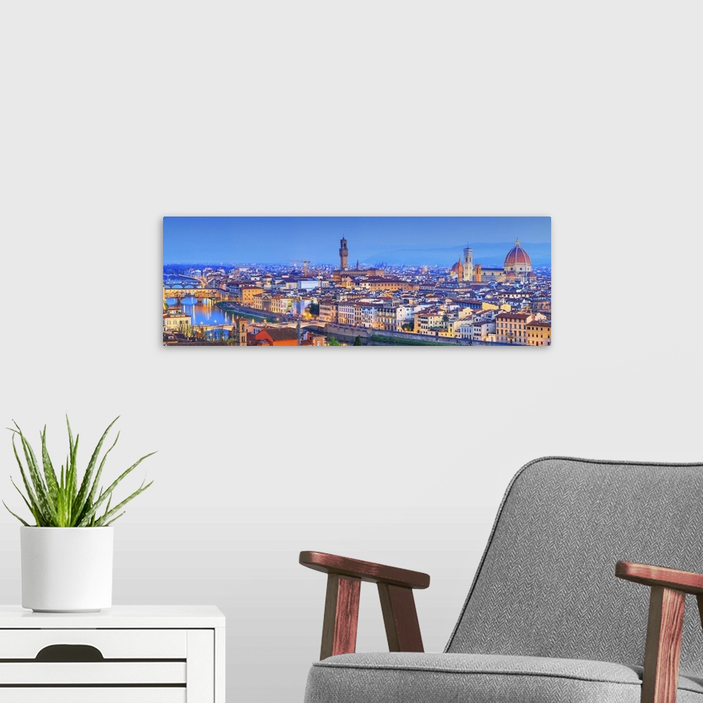 A modern room featuring Italy, Tuscany, Firenze district, Florence, City illuminated at dusk.