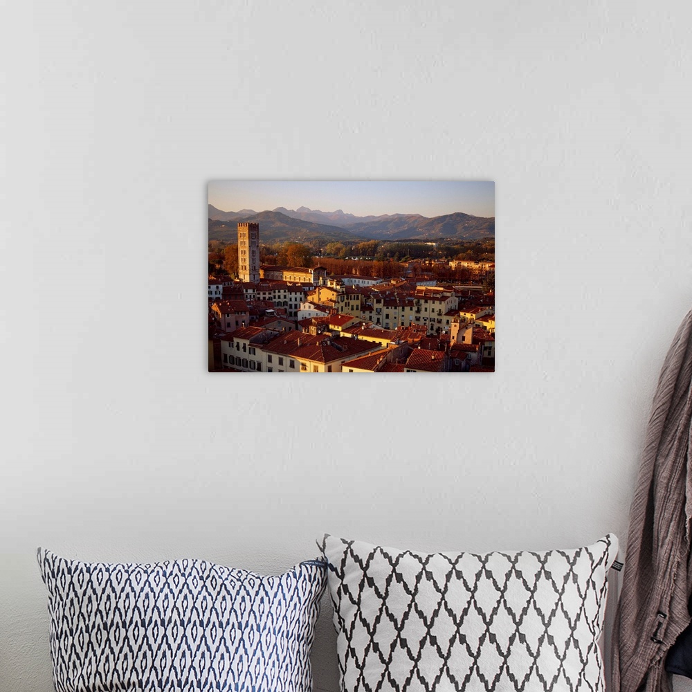 A bohemian room featuring Italy, Tuscany, Lucca, View across the city at sunset